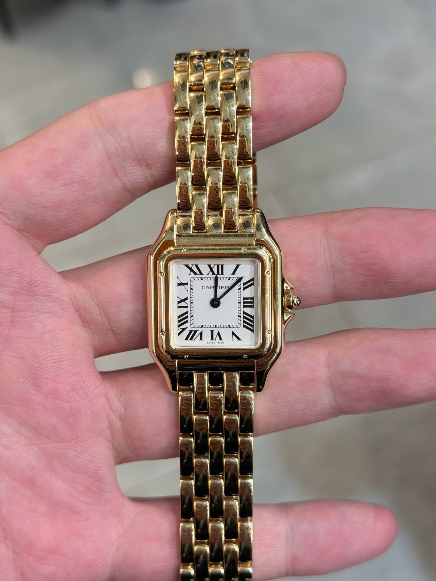 May be an image of wrist watch and text