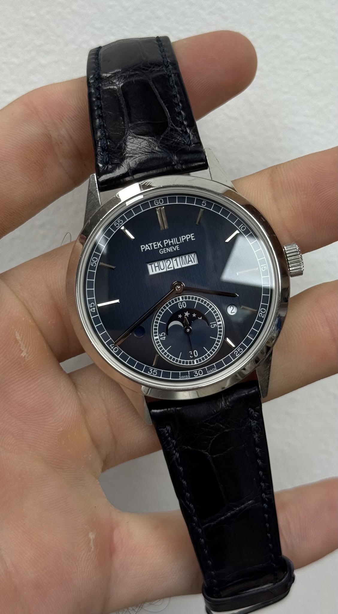 May be an image of wrist watch and text