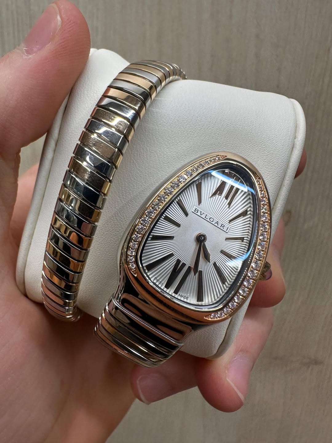 May be an image of digital watch, jewelry and text