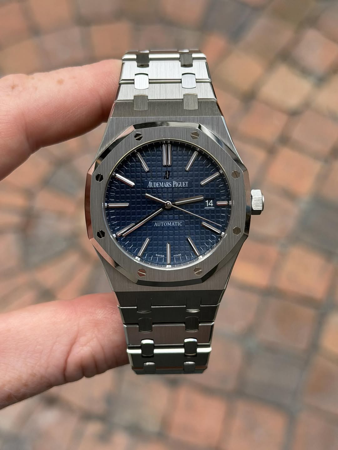 May be an image of wrist watch and text
