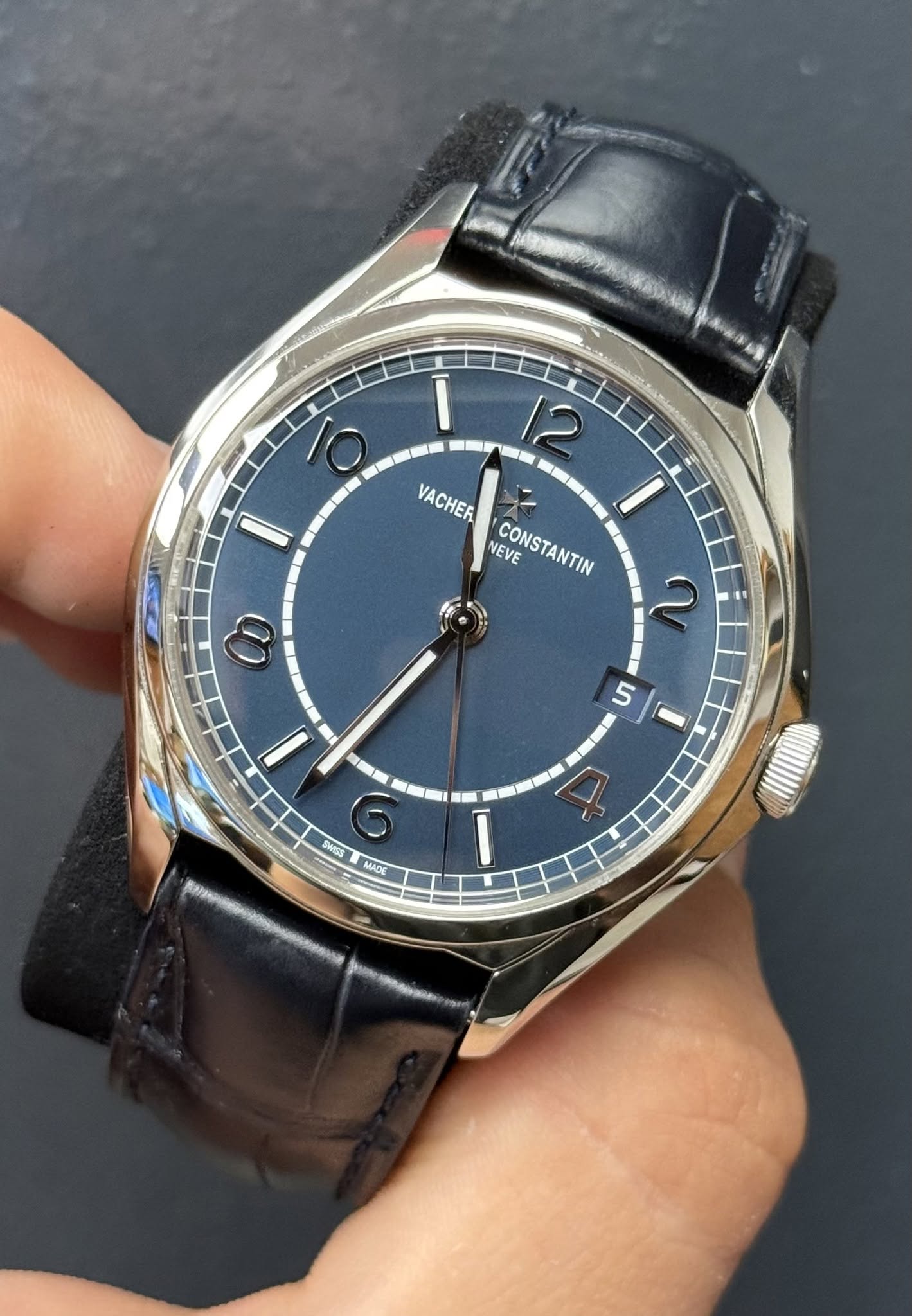 May be an image of wrist watch and text