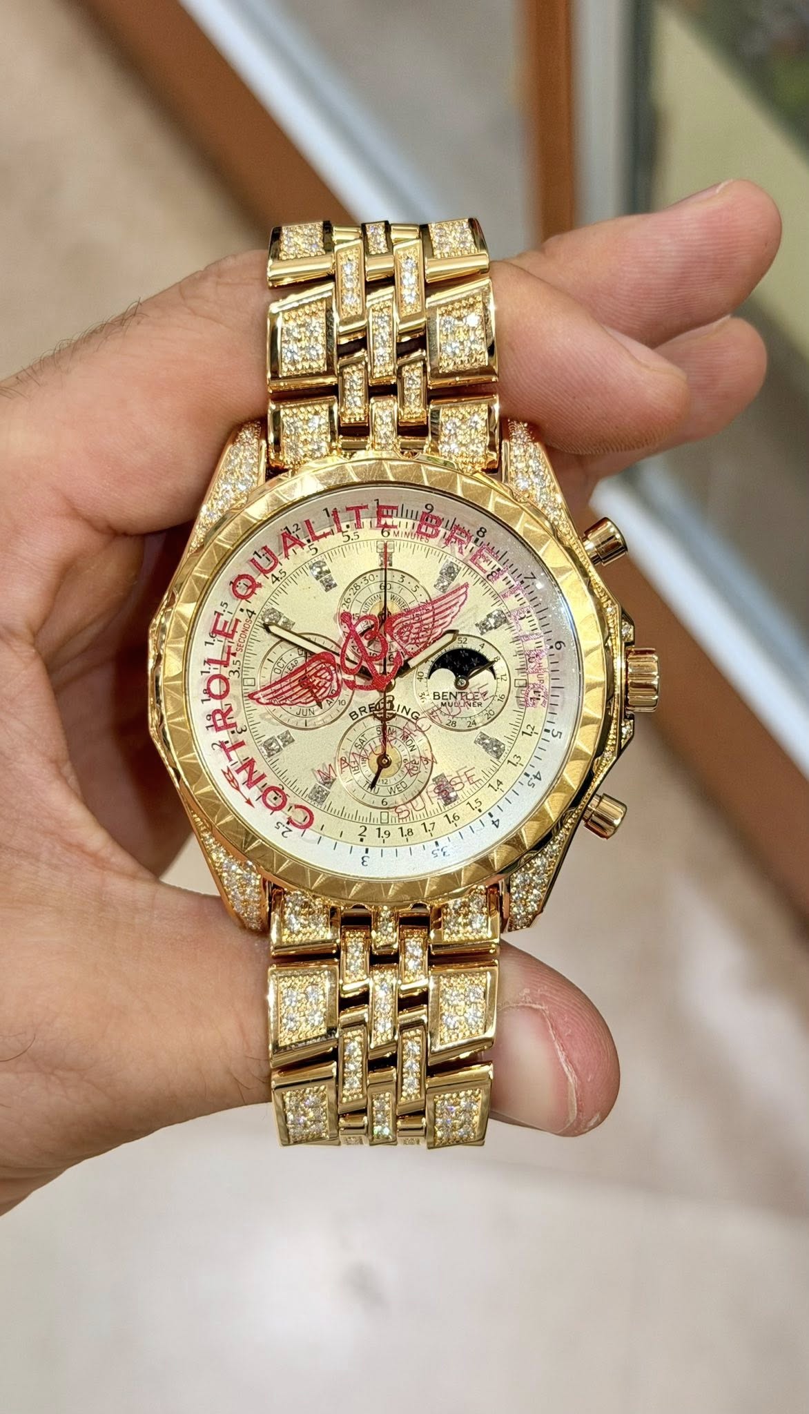 May be an image of wrist watch and text