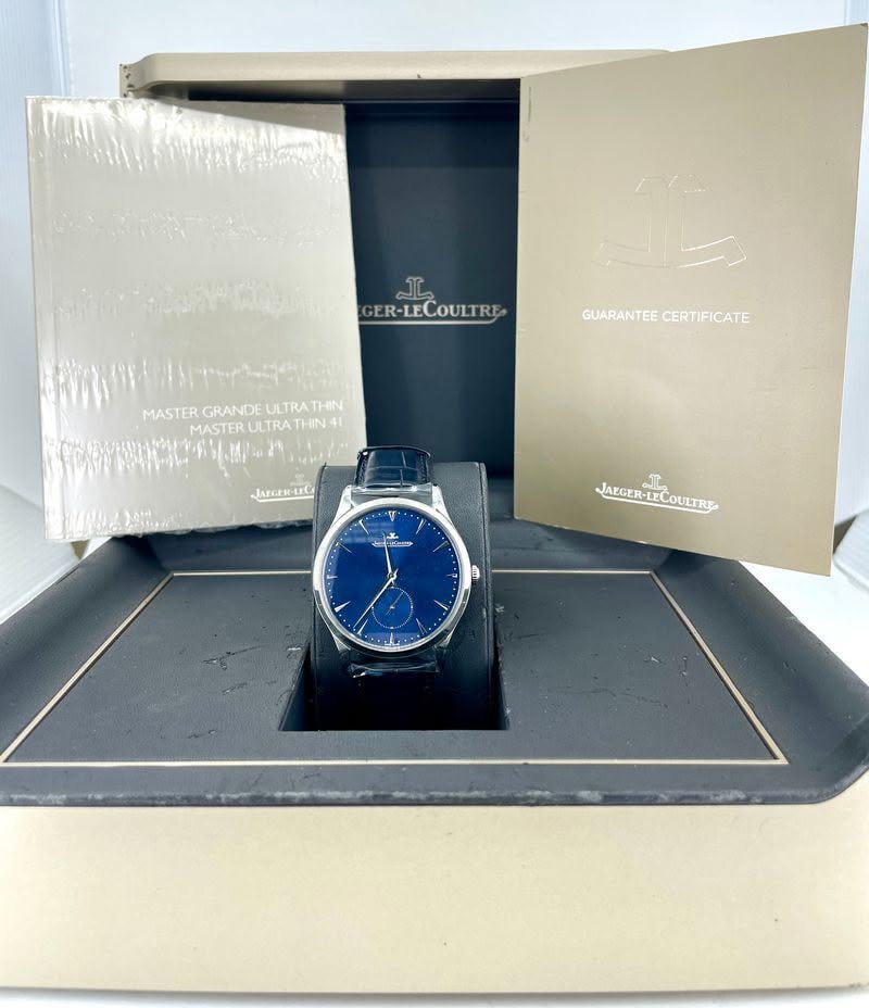 May be an image of digital watch and text that says 'GER-LECOULTRE GUARANTEE GUARANTEECERTIFICATE CERTIFICATE MASTERGRANDEULTRATHN MASTER GRANDE ULTRATHIN MASTER ULTRATI THIN4…
