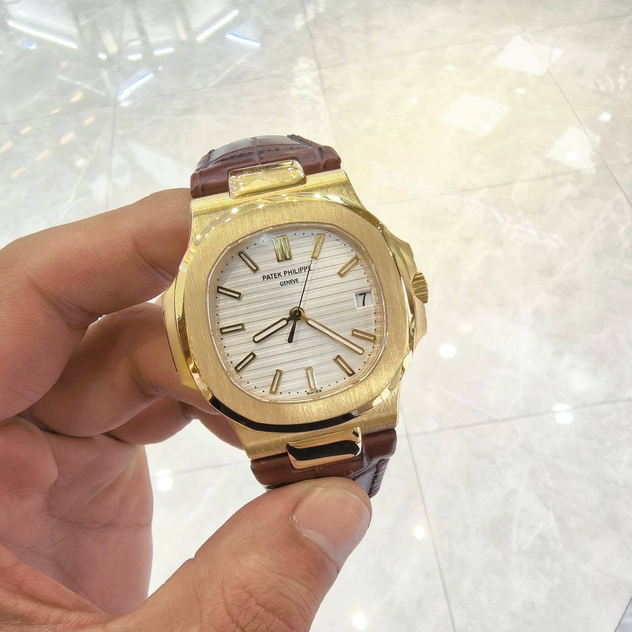 May be an image of wrist watch and text