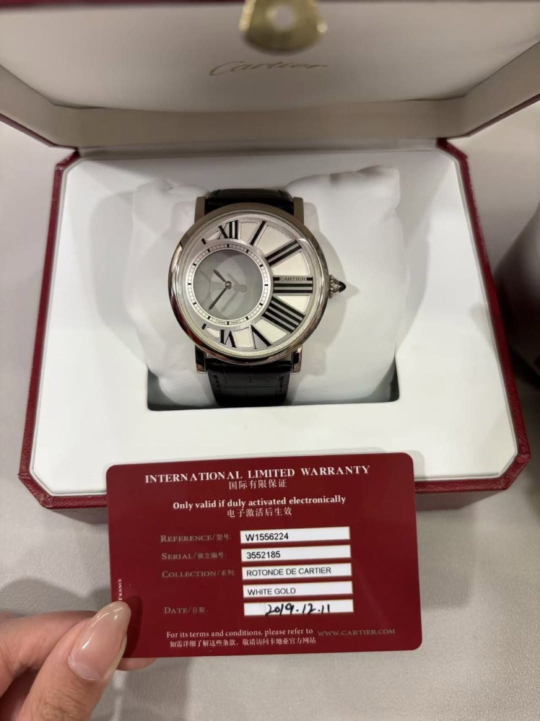 May be an image of wrist watch and text