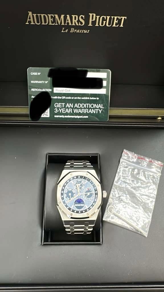 May be an image of wrist watch and text that says 'AUDEMARS PIGUET Le Brassus CASEN WAPRANTYN REF/COLLECTION Royal Oak Pe ត៉ាវាត code onte ಮಾಕ್ಿಣ belbwrka K GET AN ADDITIONAL…