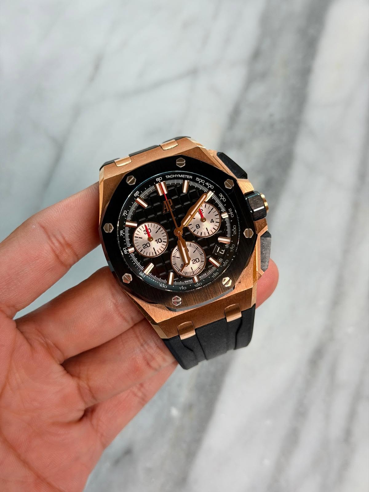 May be an image of wrist watch and text