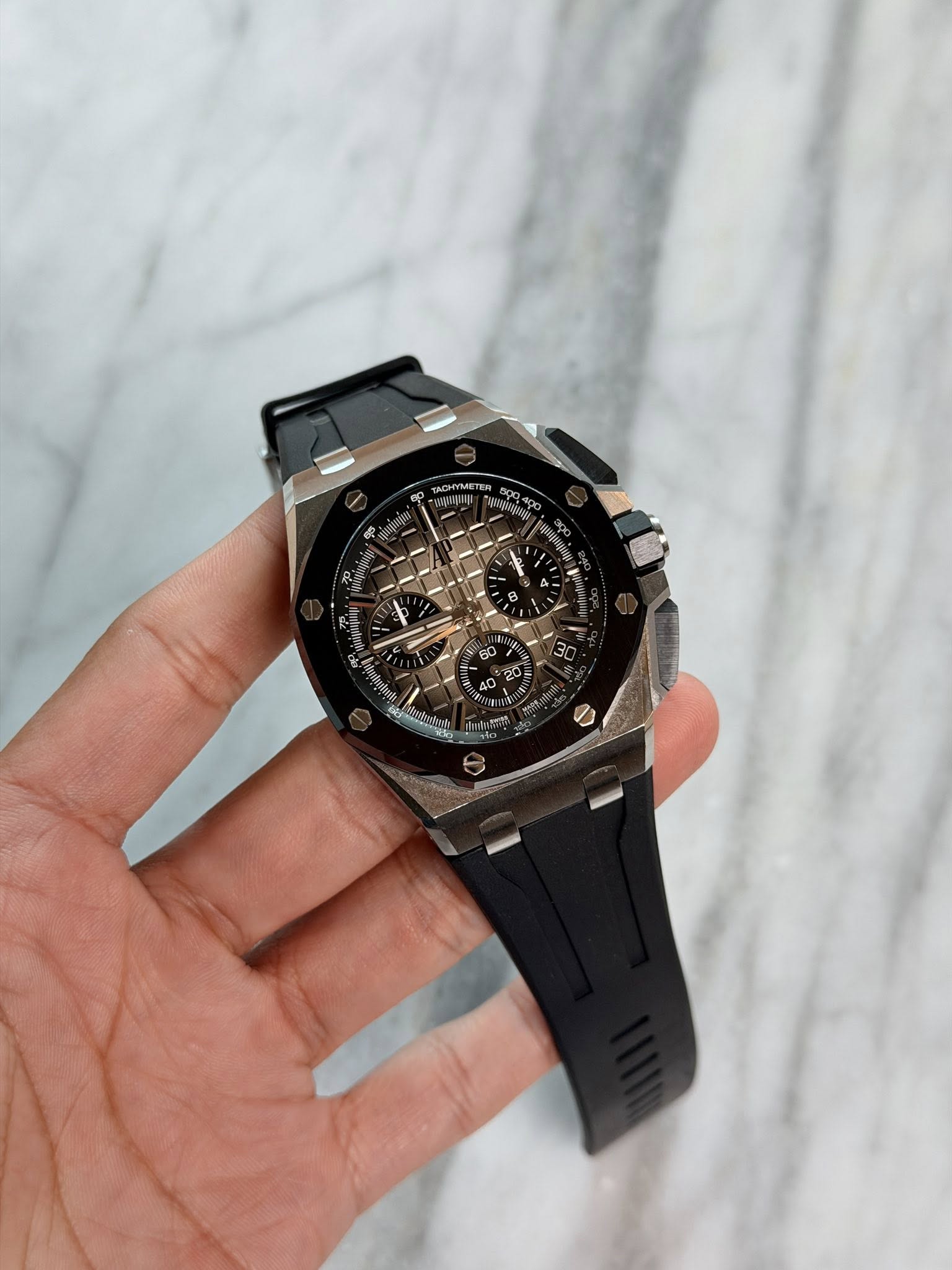 May be an image of wrist watch and text