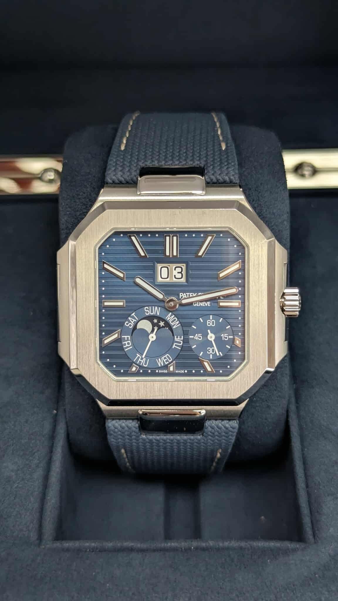 May be an image of digital watch and text that says '03 PATEV GENEVE a SUN MON SAT 비- 벌 ገህ WED a GIDE'