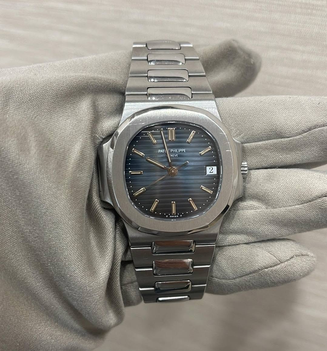 May be an image of wrist watch and text