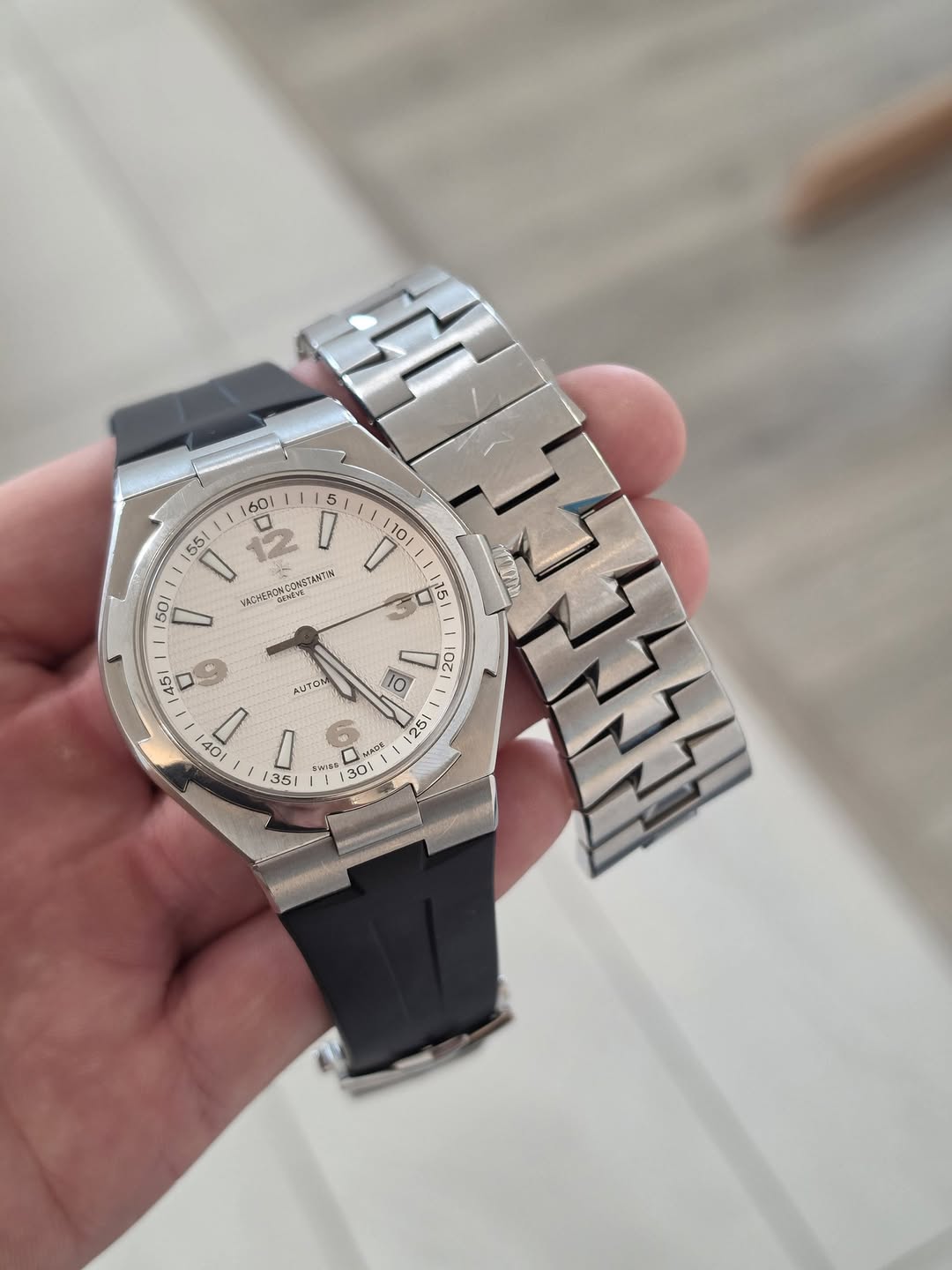 May be an image of wrist watch and text