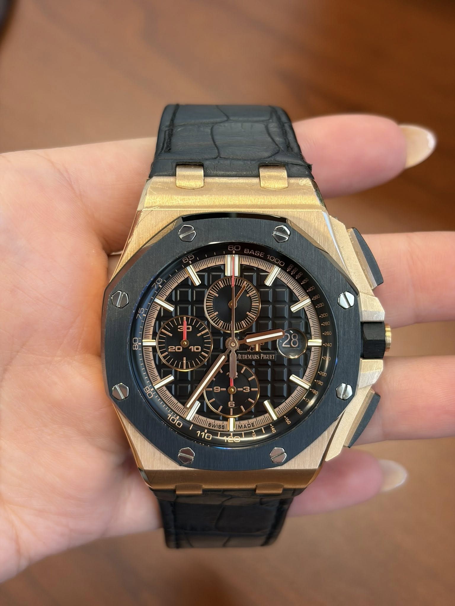 May be an image of wrist watch and text
