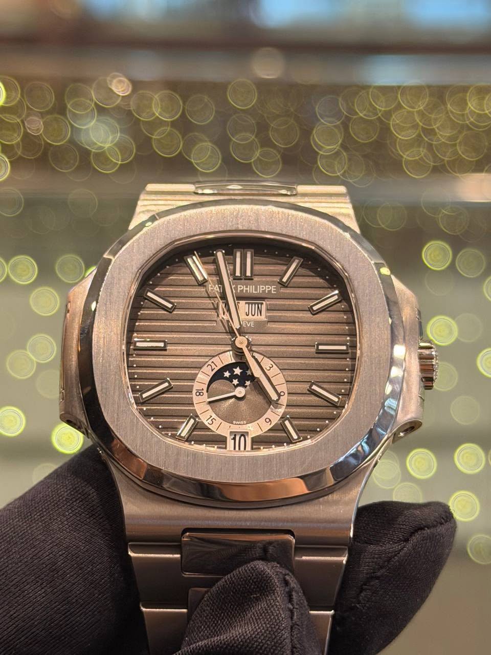 May be an image of wrist watch and text