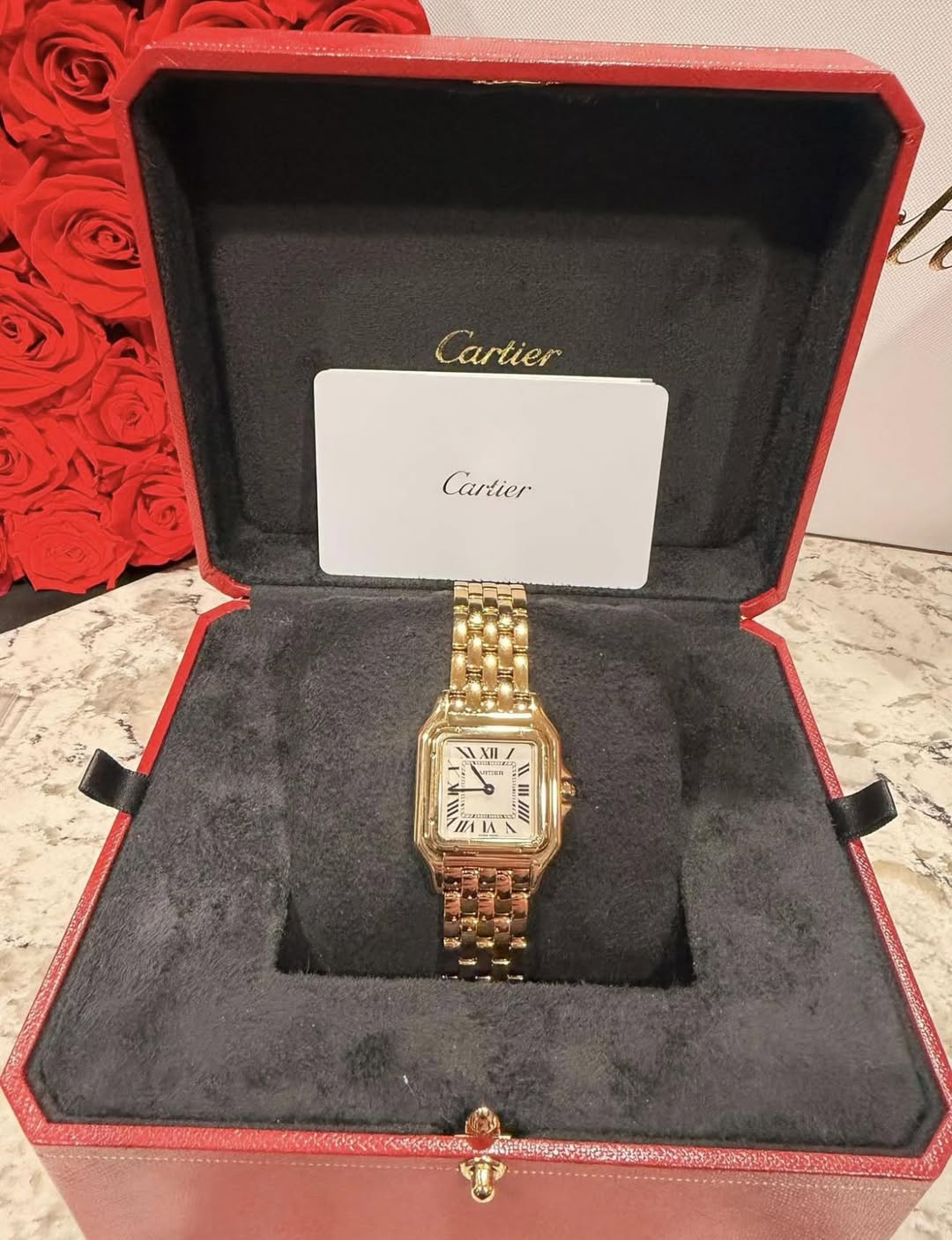 May be an image of wrist watch and text that says 'Cartier Cartier XII II II 1 IA'