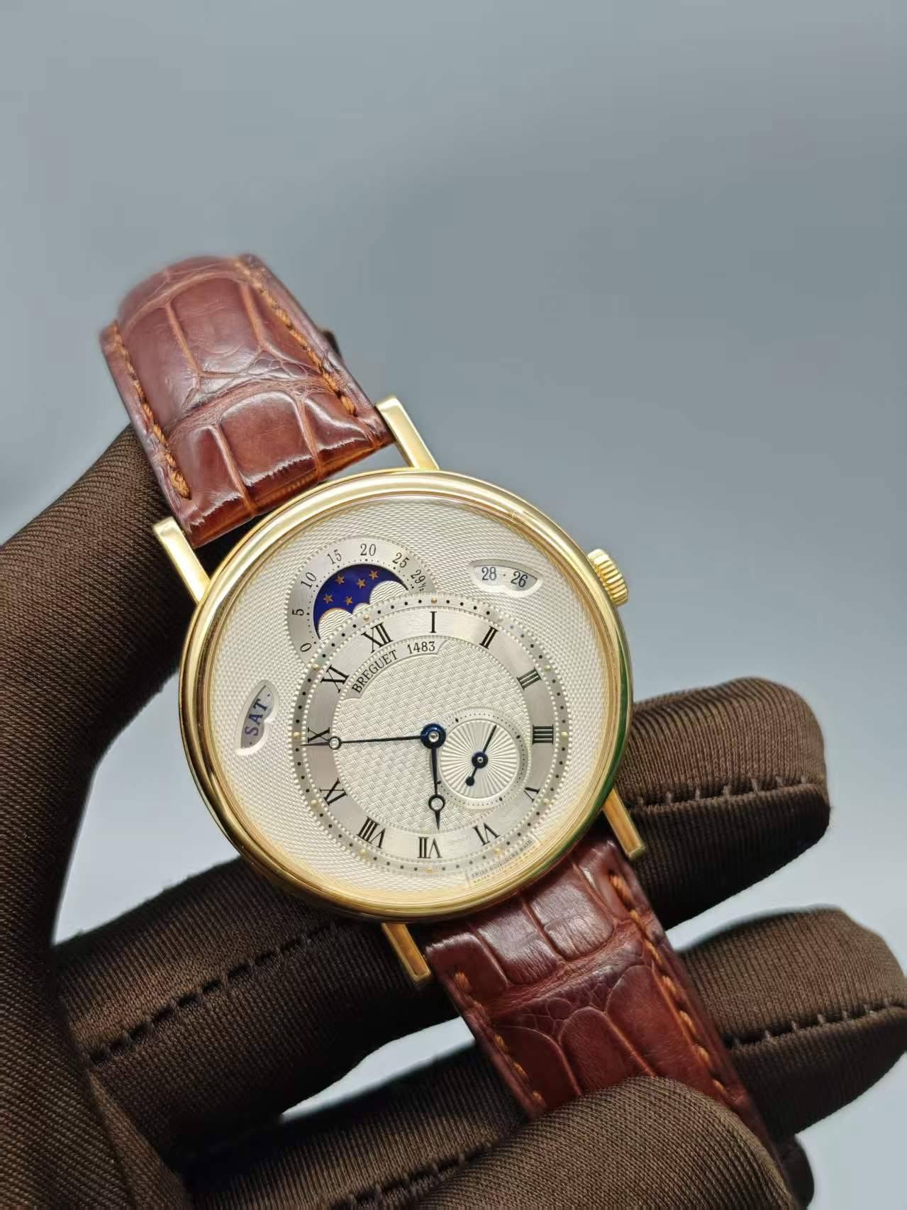 May be an image of wrist watch and text that says '20 15 0 ၁ 28.26 28 WH XII REGUET 1483 II SAT III I O 1 I'