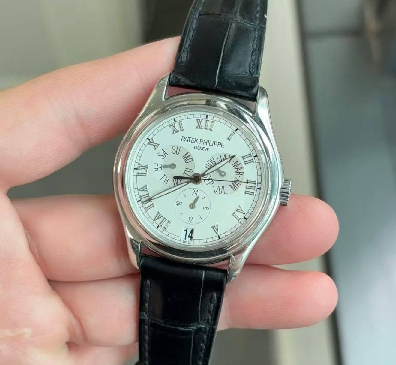 May be an image of wrist watch and text that says 'XIL PATEK PATEKPHILIPPE GENEVE PHILIPPE SA SU II F TH K W ΠΑ MAR IIII JL MA पी AI 24 I ® တ 12 14 InYONA V'