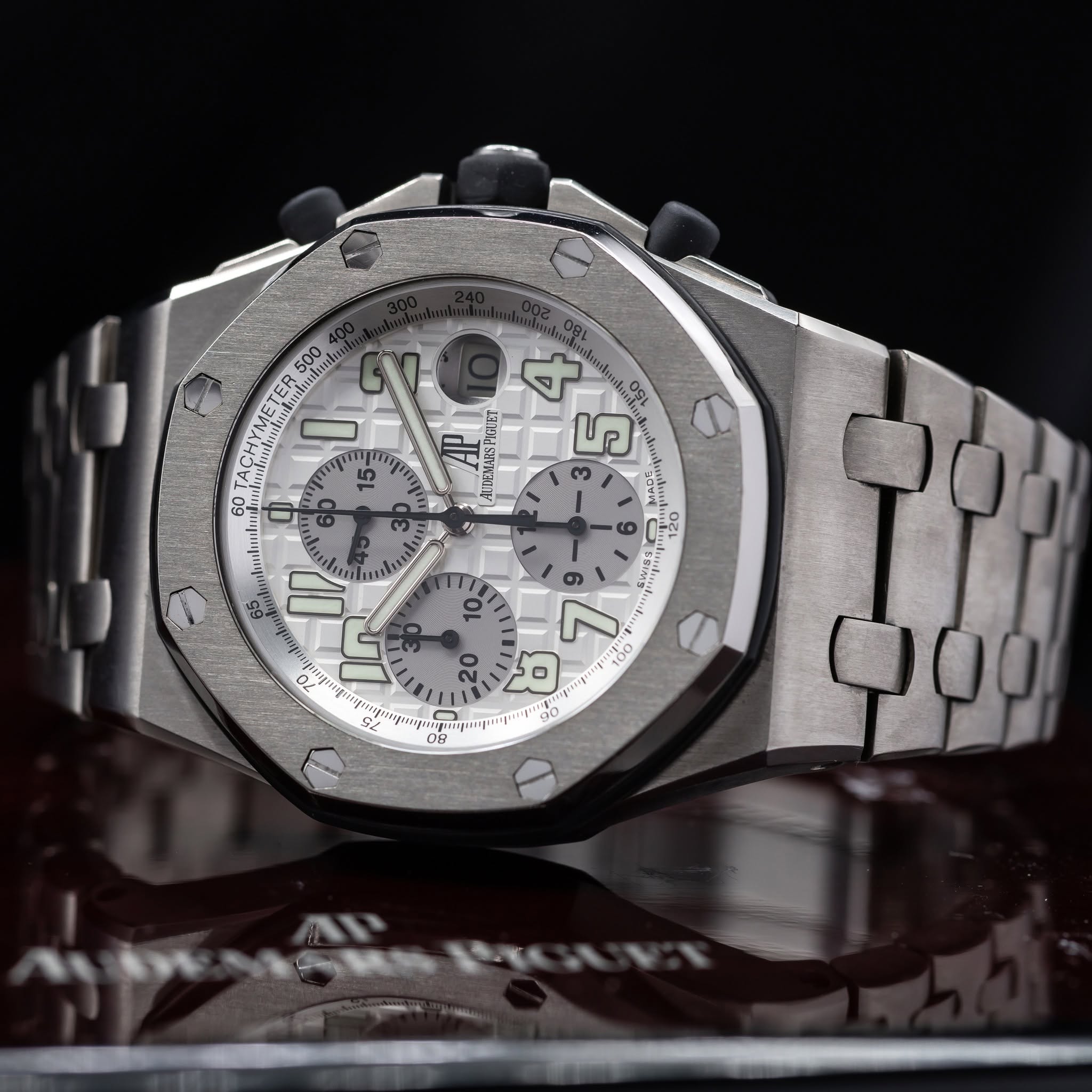 May be an image of wrist watch and text