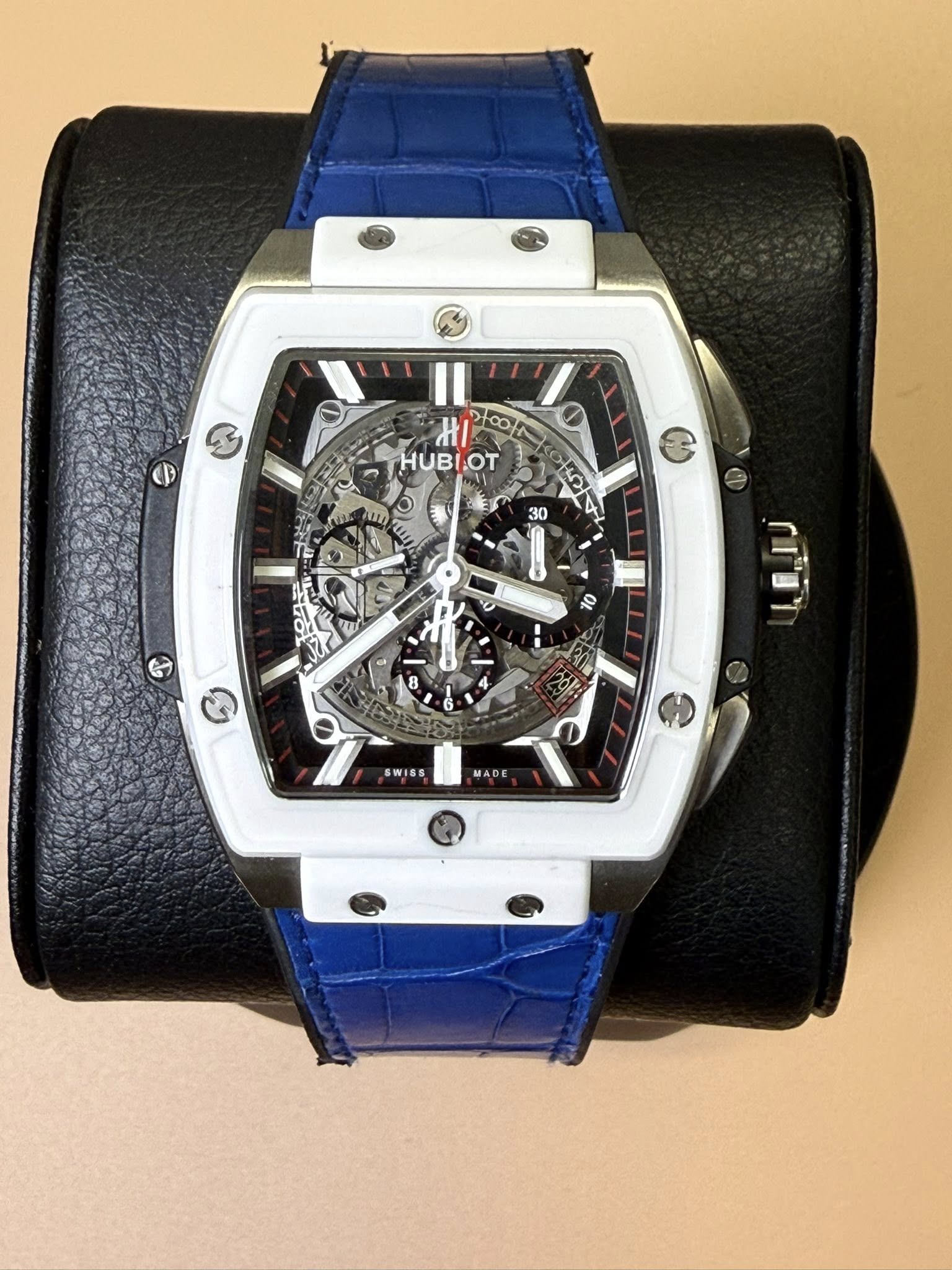 May be an image of wrist watch and text