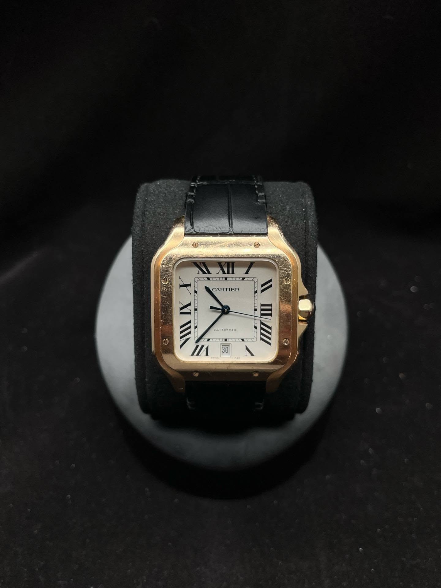 May be an image of digital watch, leather and text