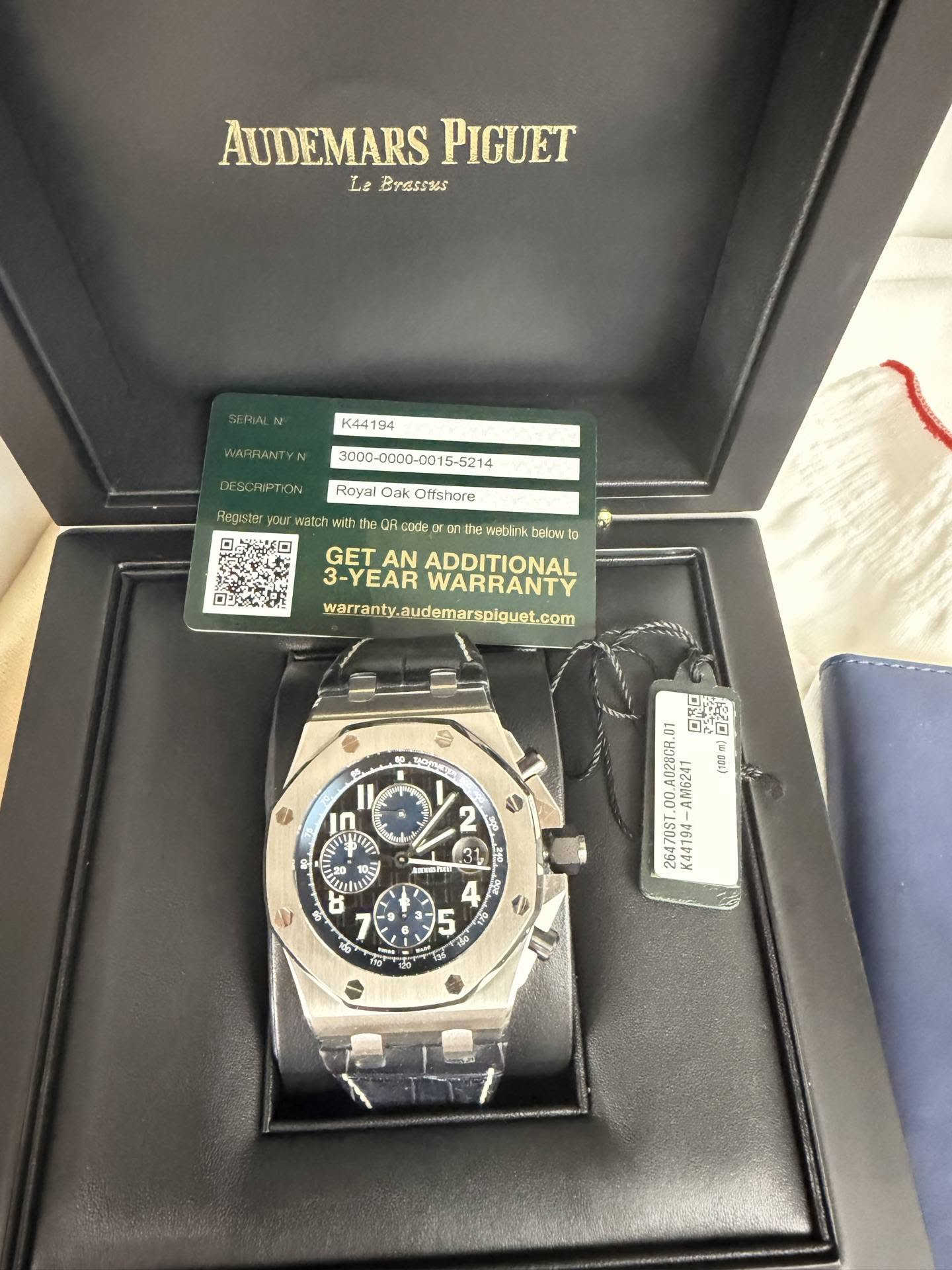 May be an image of wrist watch and text that says 'AUDEMARS PIGUET Le Brassss SERIAL K44194 WARRANTYN DESCRIPTION Register Royal Oak Offshore watci with code h watlink helow 10…