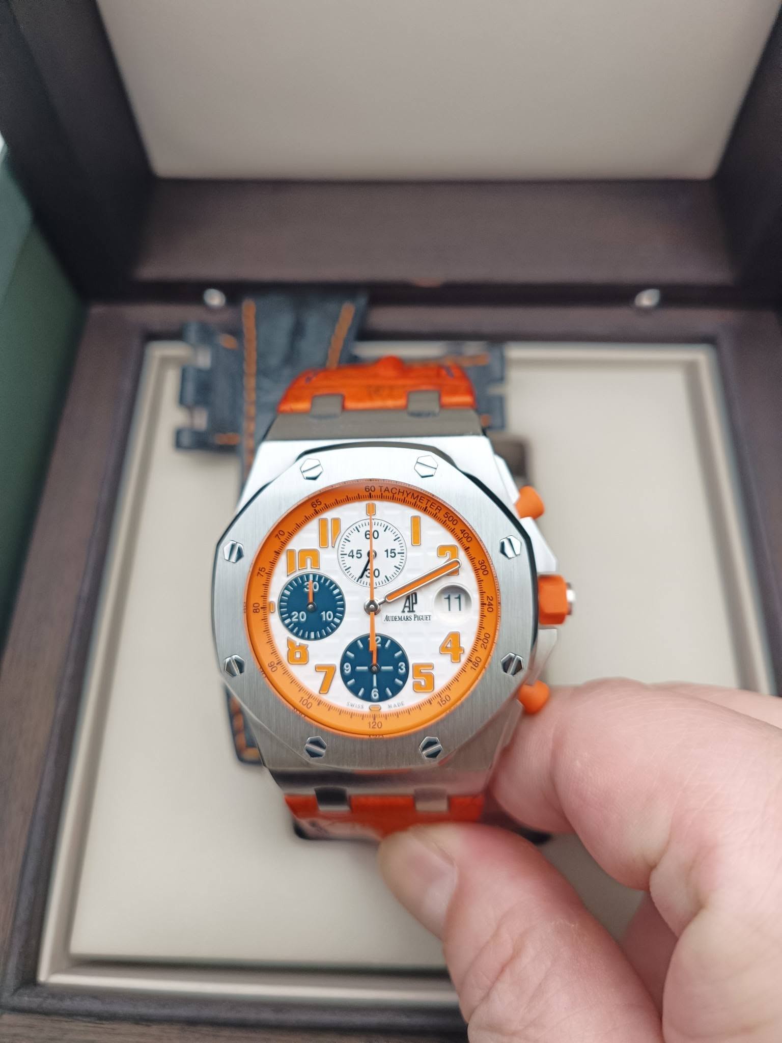 May be an image of wrist watch and text