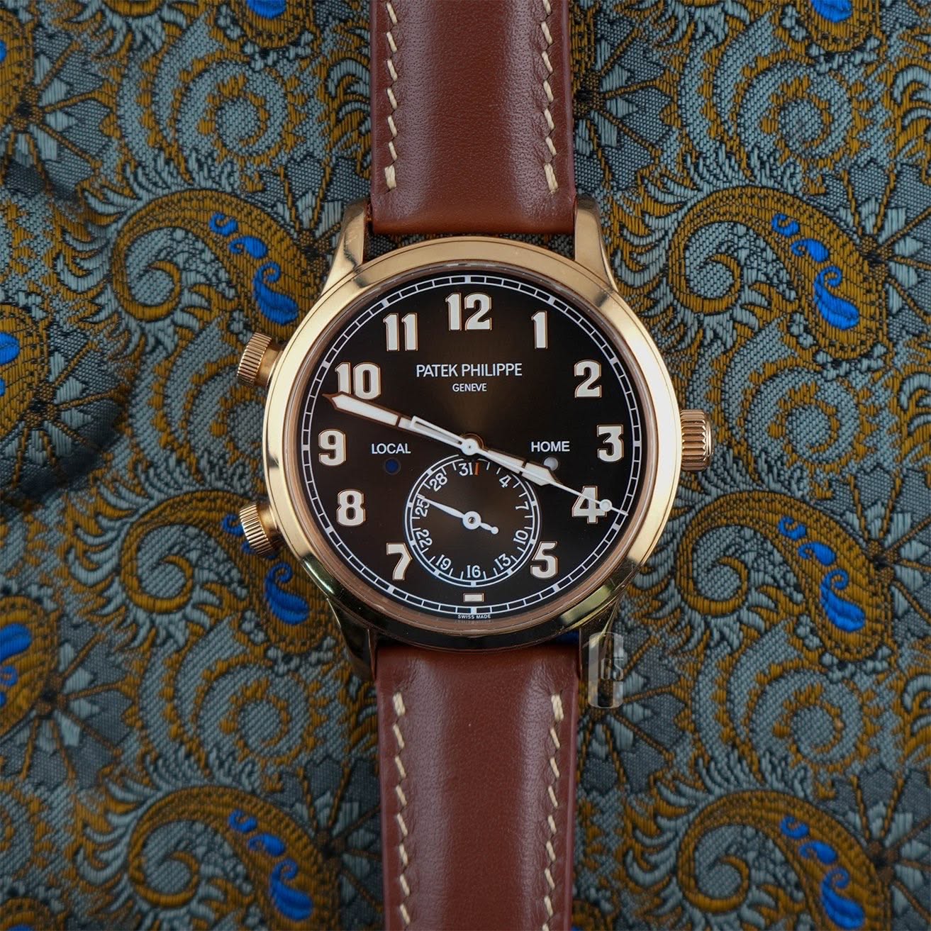 May be an image of wrist watch and text that says '11 12 10 PATEK PHILIPPE GENEVE 2 LOCAL 9 HOME 31 28ိ 4 3 8 WAEIA 4 22 19、 16 13 M OF 9 5 CD'