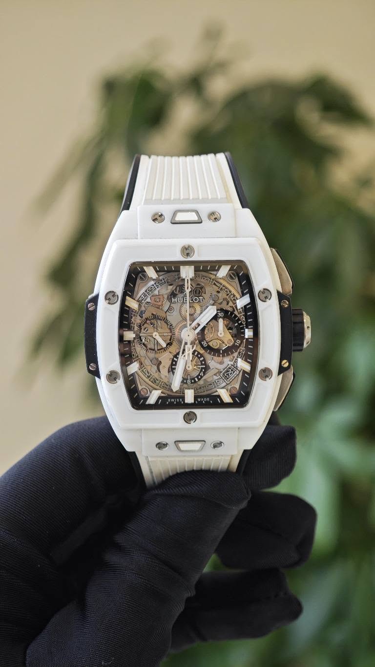 May be an image of wrist watch and text that says 'খ HUELOT oT HUE T'