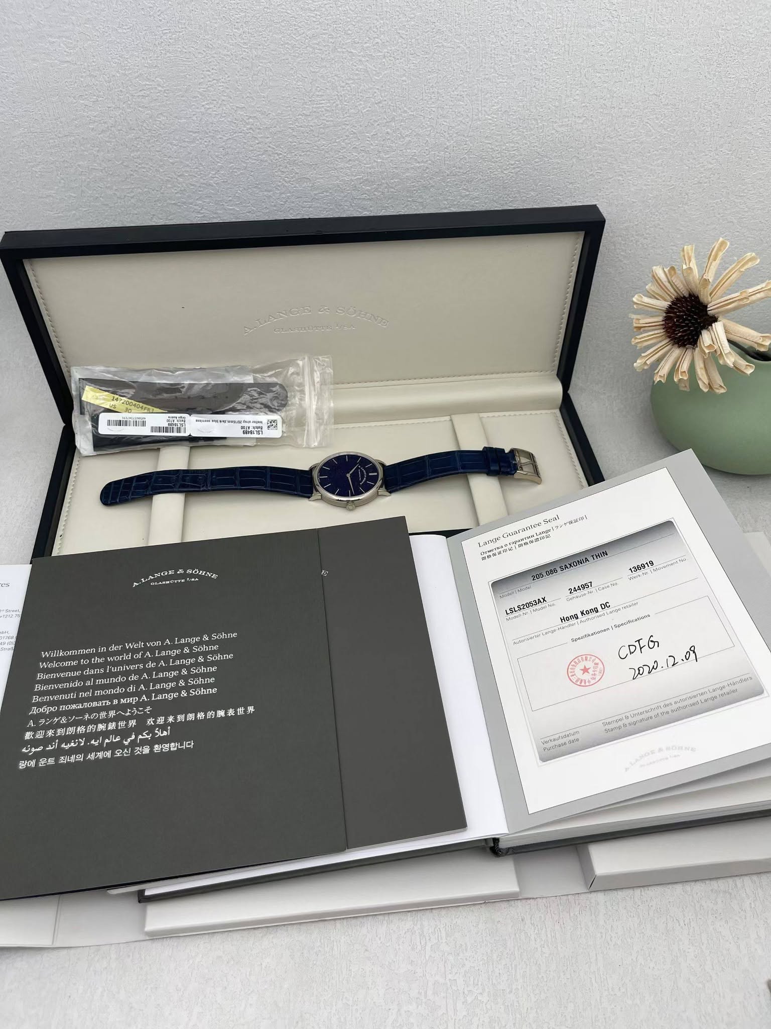May be an image of digital watch, book and text
