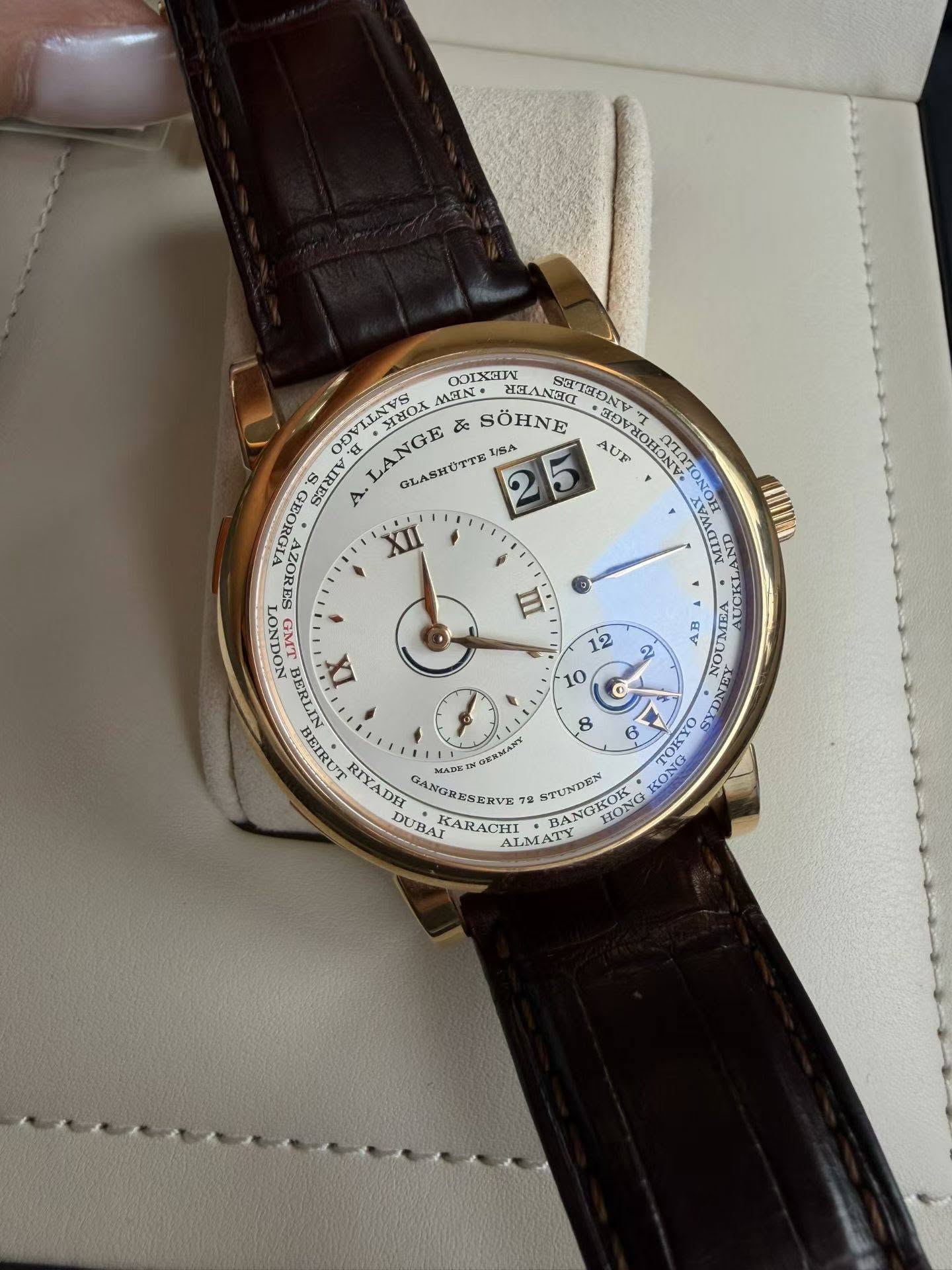 May be an image of wrist watch and text