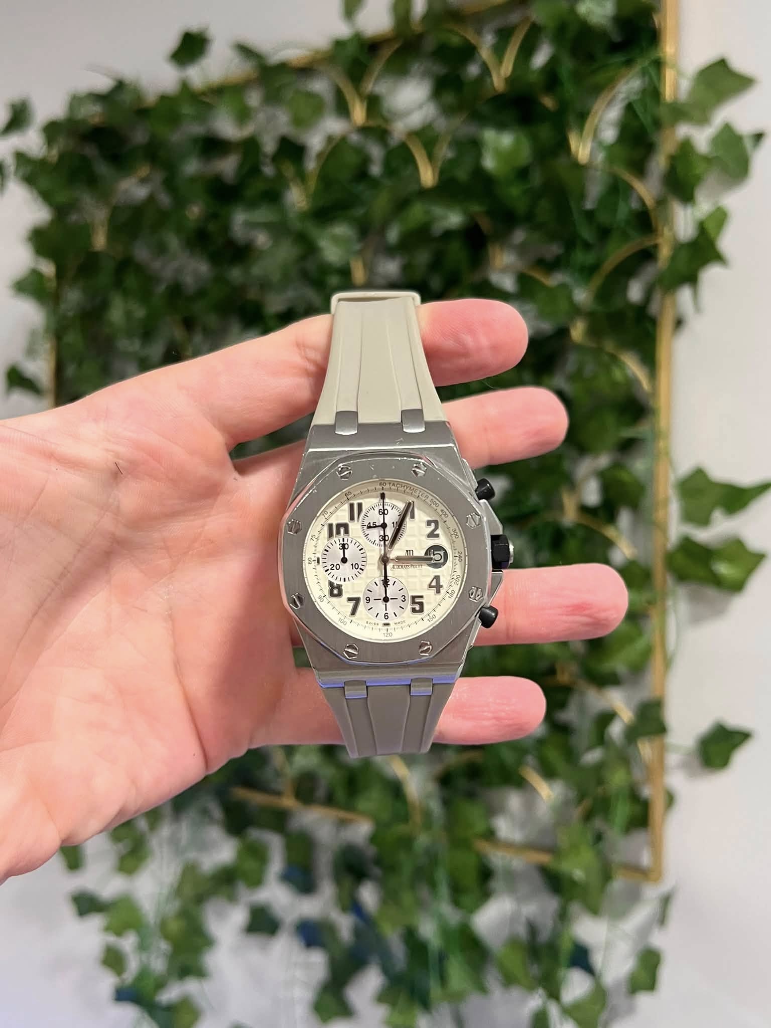 May be an image of wrist watch and text