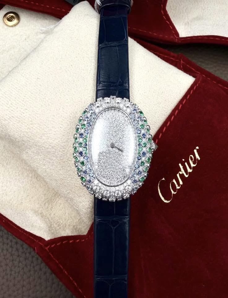 May be an image of wrist watch and text that says 'Cartier'