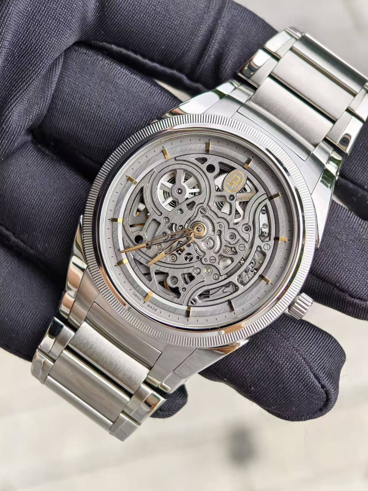 May be an image of wrist watch and text