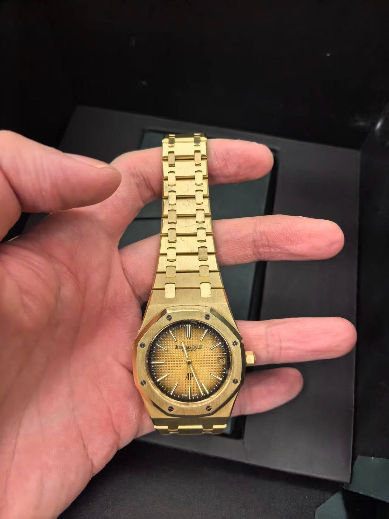 May be an image of wrist watch and text