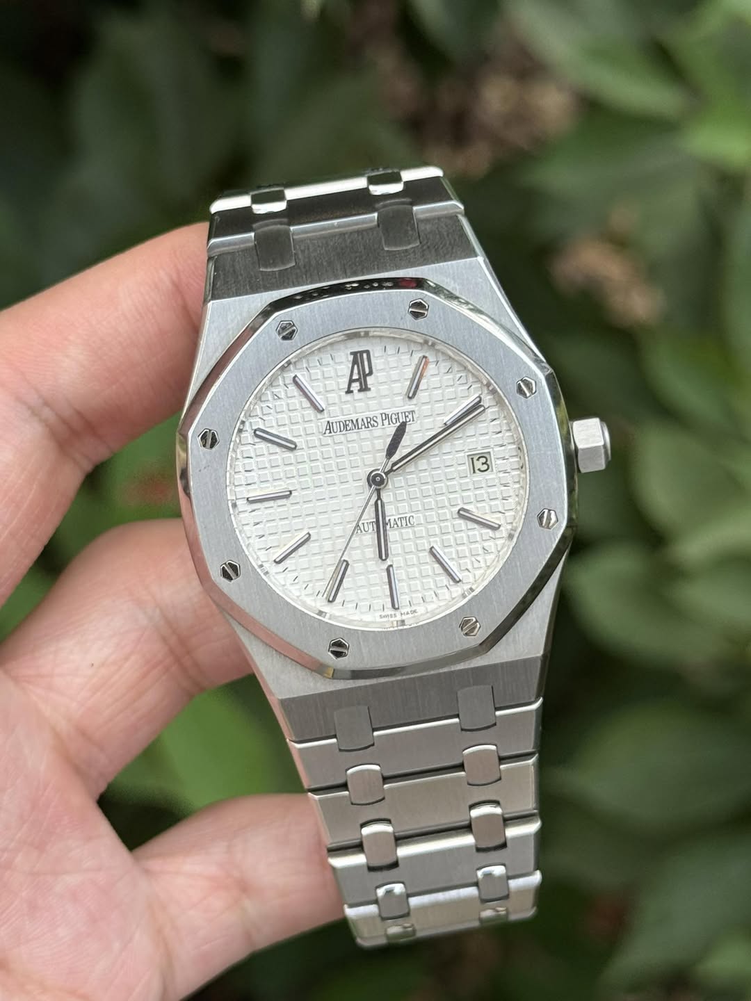 May be an image of wrist watch and text