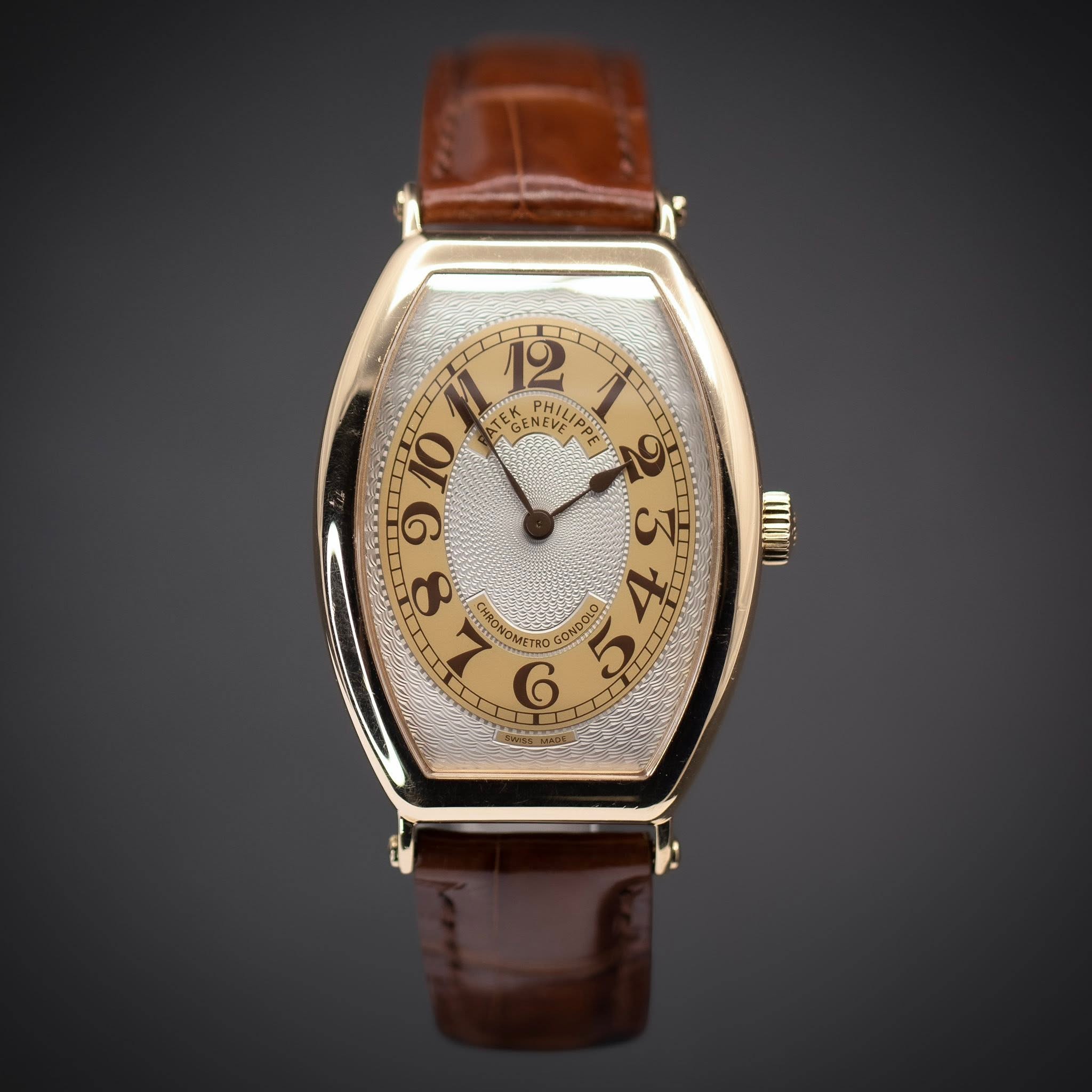 May be an image of wrist watch and text that says '+ EGEN GULD MEVE PHIL HILIB קיים 2 HILIPA 10 TEK NEVE EA G & 8 HRO NOMETRO GOND NDO G OII'