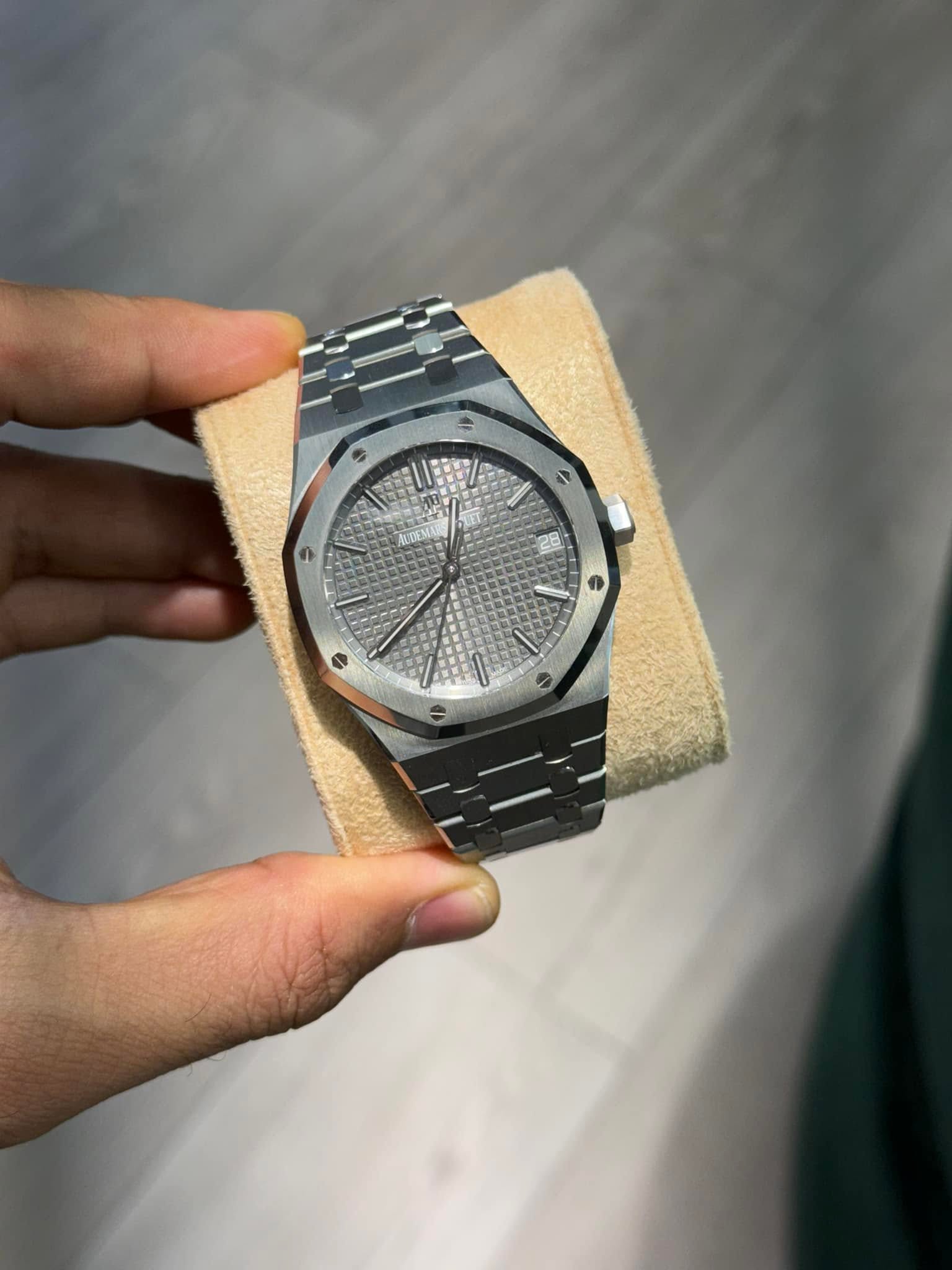 May be an image of wrist watch and text