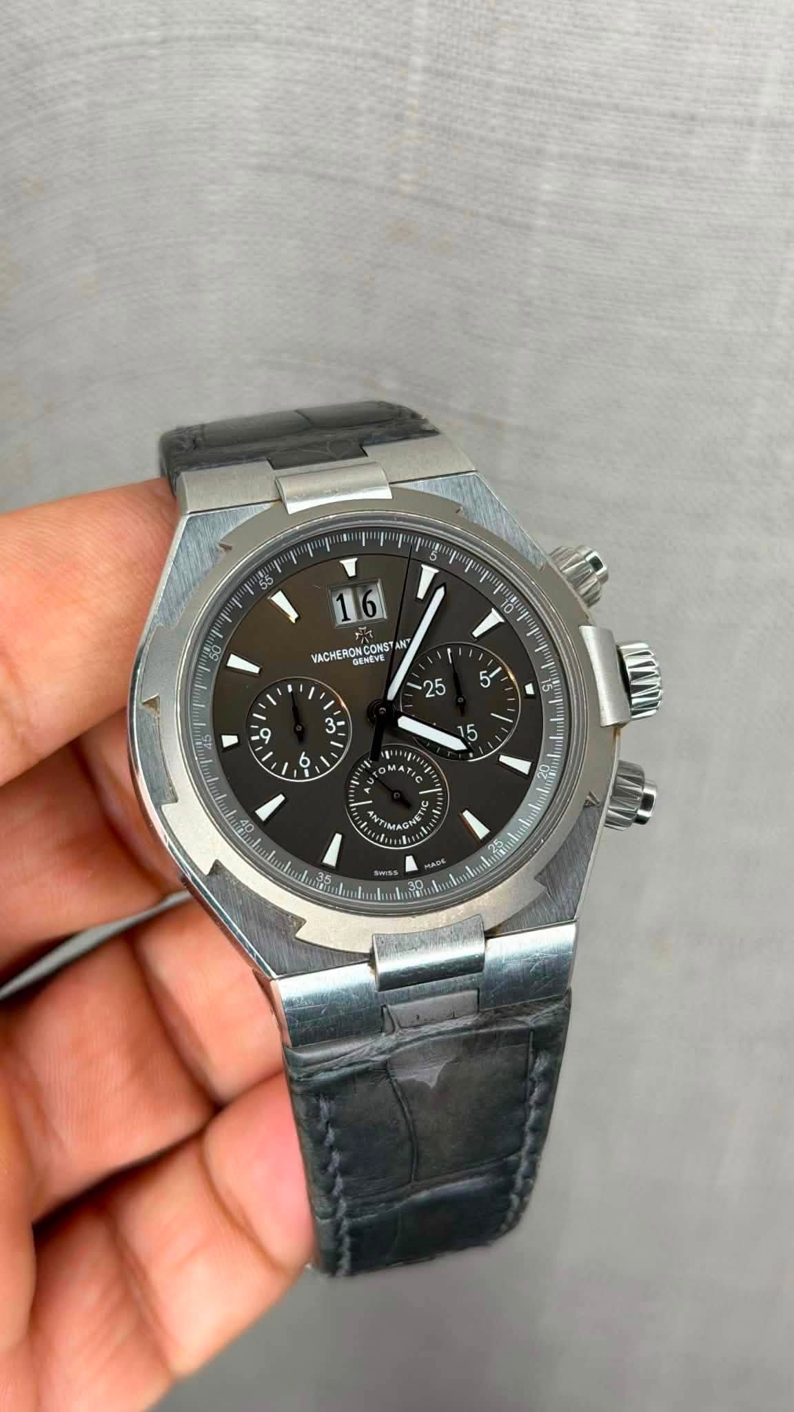 May be an image of wrist watch and text