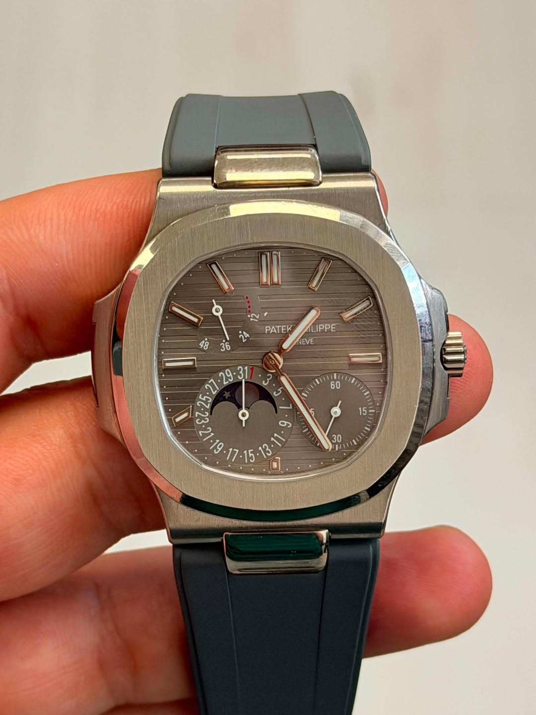 May be an image of wrist watch and text