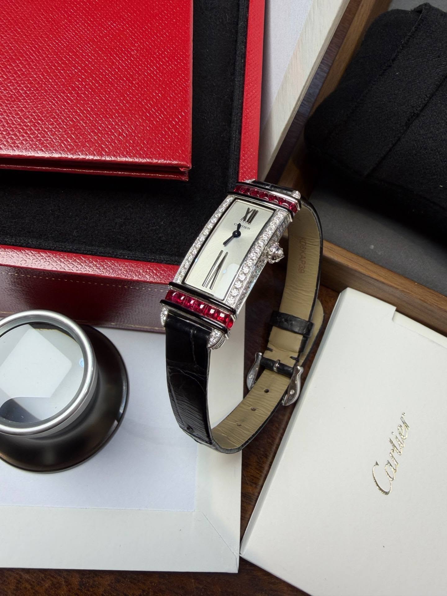 May be an image of saddle-stitched leather, leather, wrist watch and text