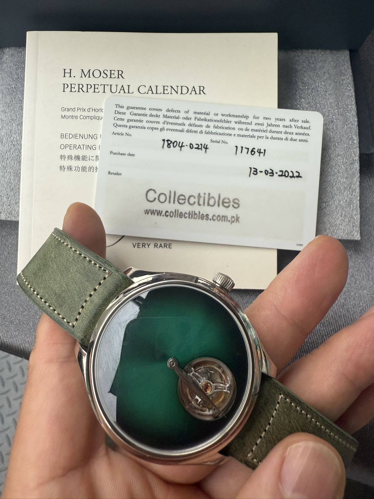 May be an image of wrist watch and text that says 'H. MOSER PERPETUAL CALENDAR Grand Prix d'Horic Montre Compliqu This guaranter cuvers dieferts Diese Material- gafantie couVrE…
