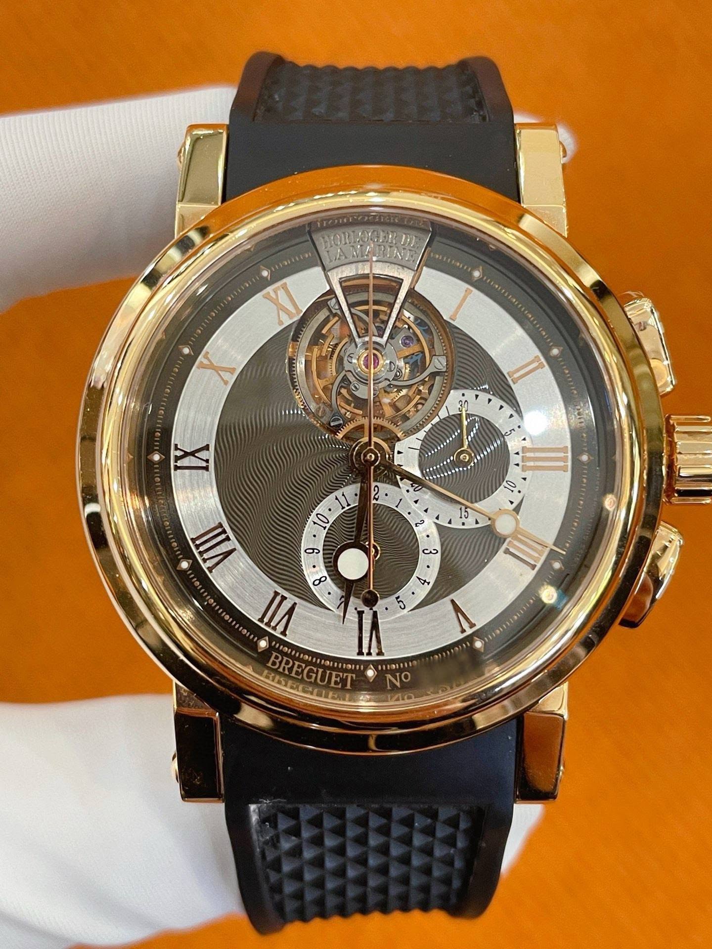 May be an image of wrist watch and text
