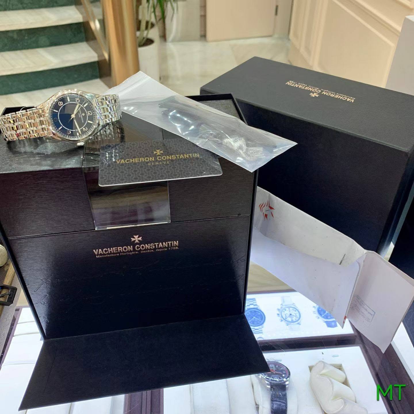 May be an image of wrist watch and text