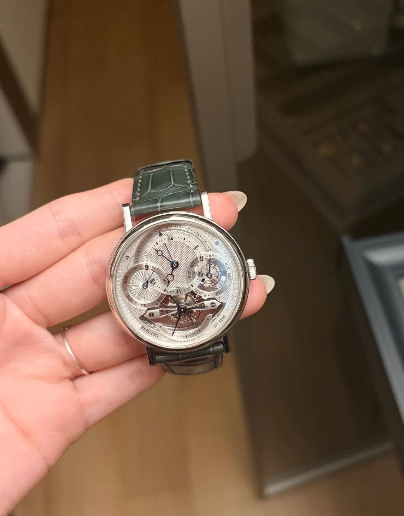 May be an image of wrist watch and text