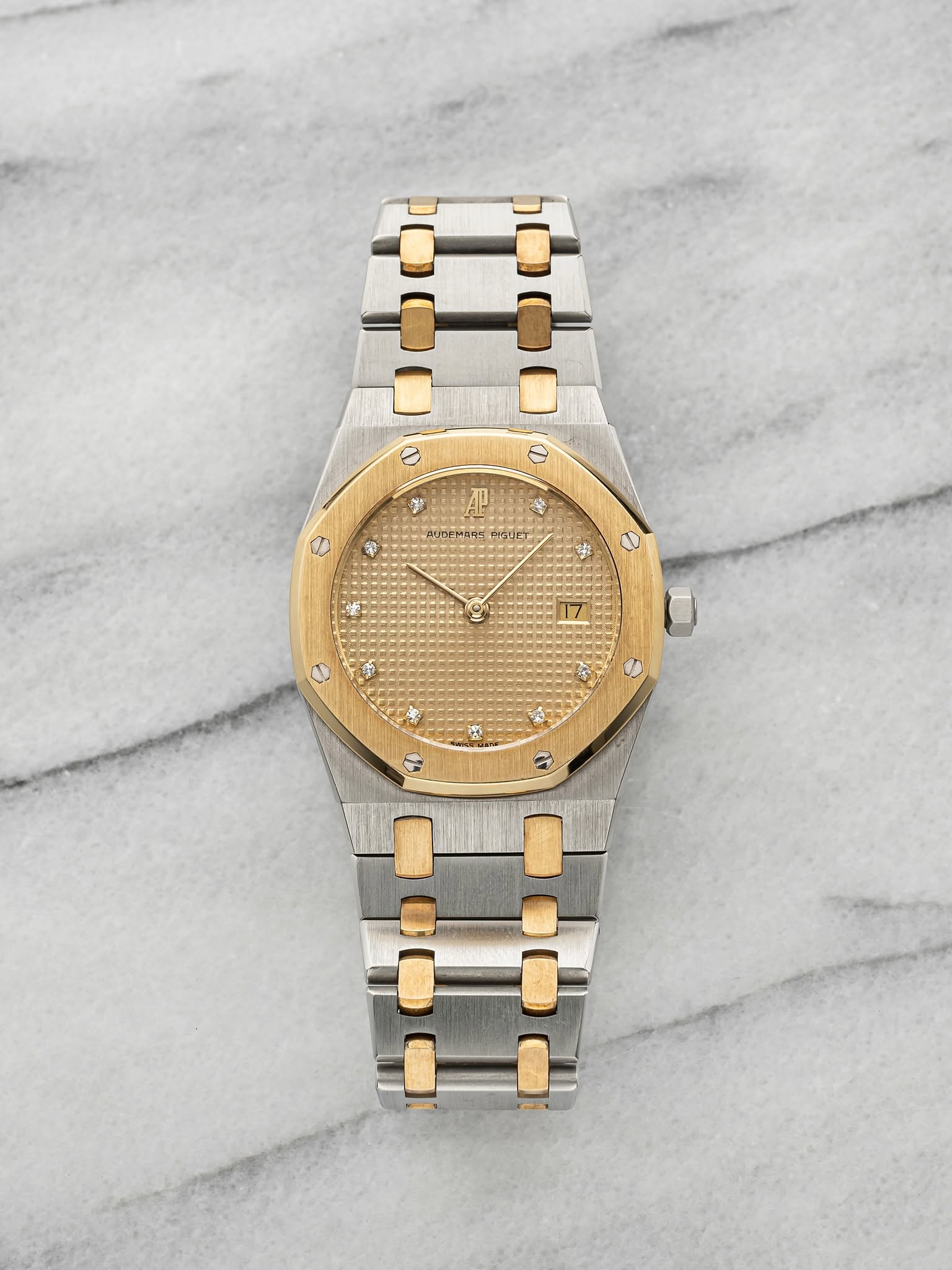 May be an image of wrist watch and text