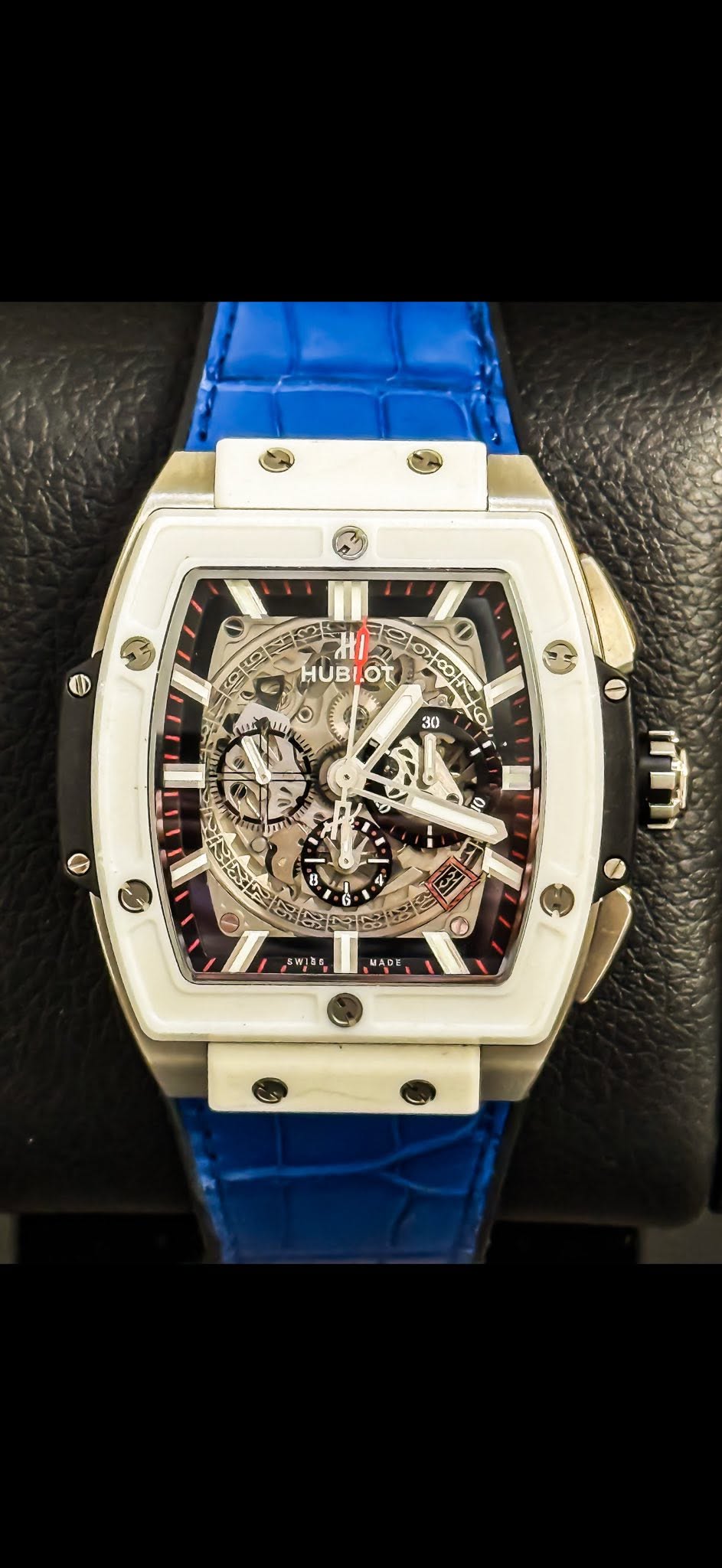 May be an image of wrist watch and text