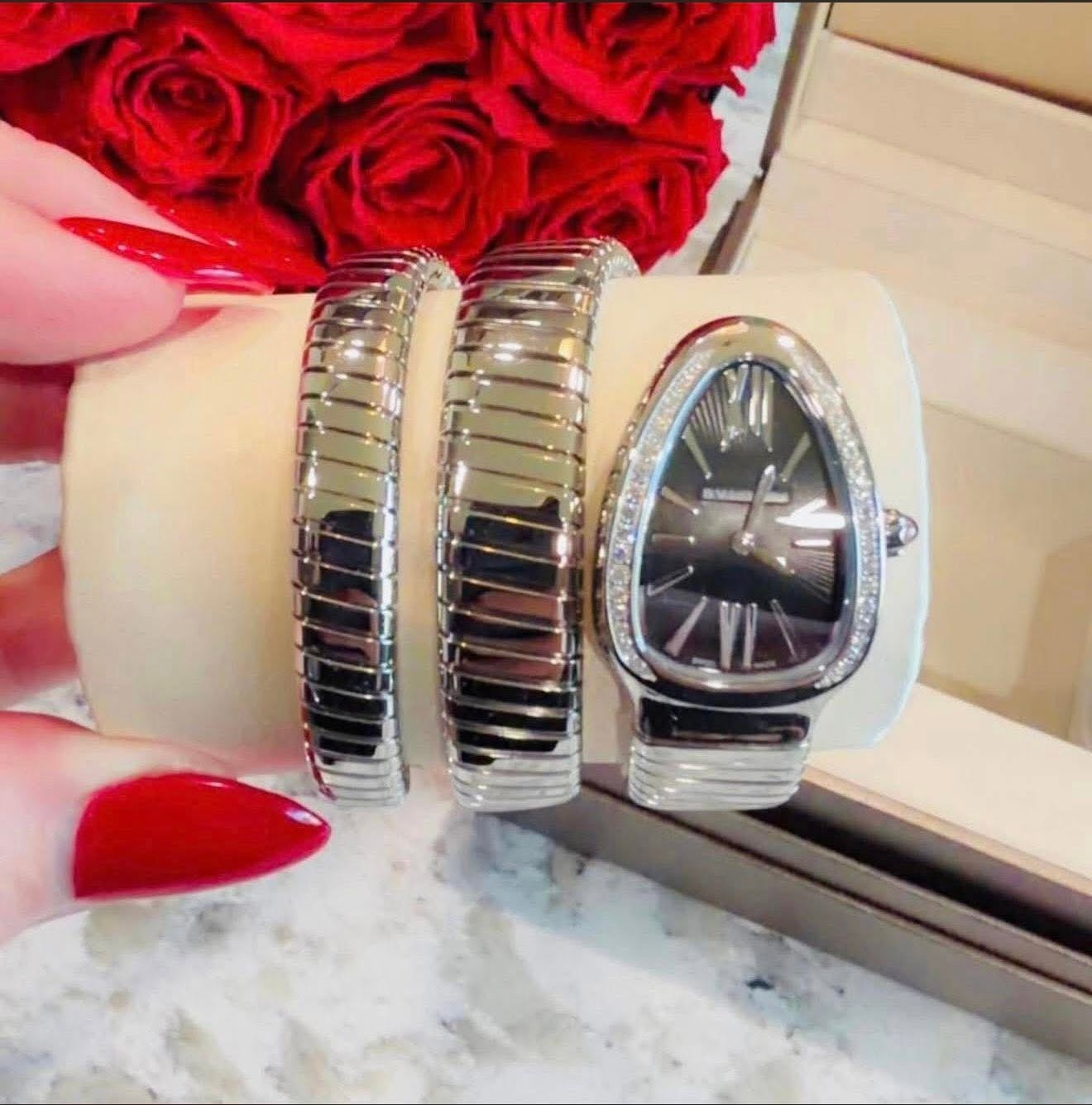 May be an image of wrist watch and jewelry