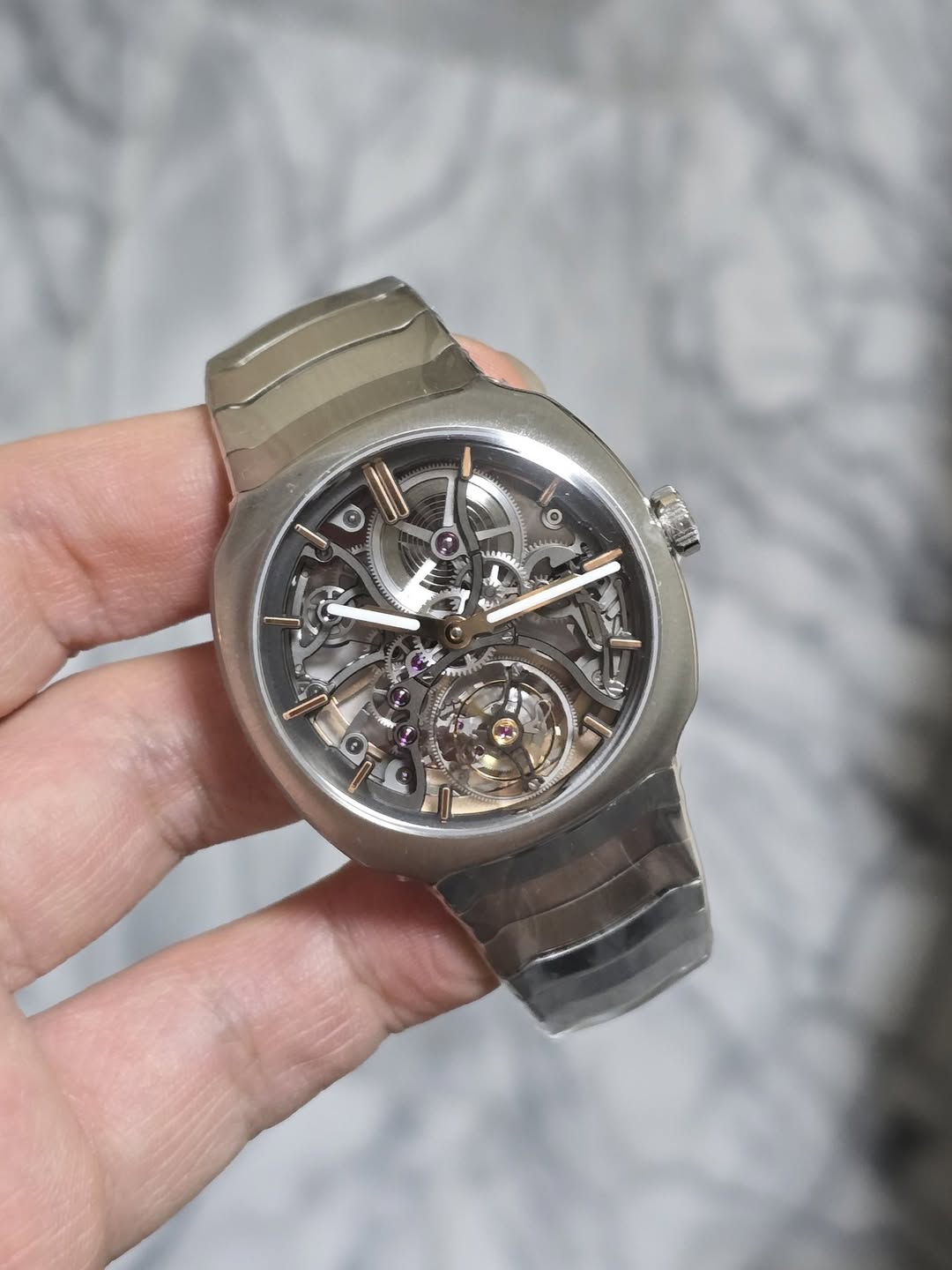 May be an image of wrist watch and text