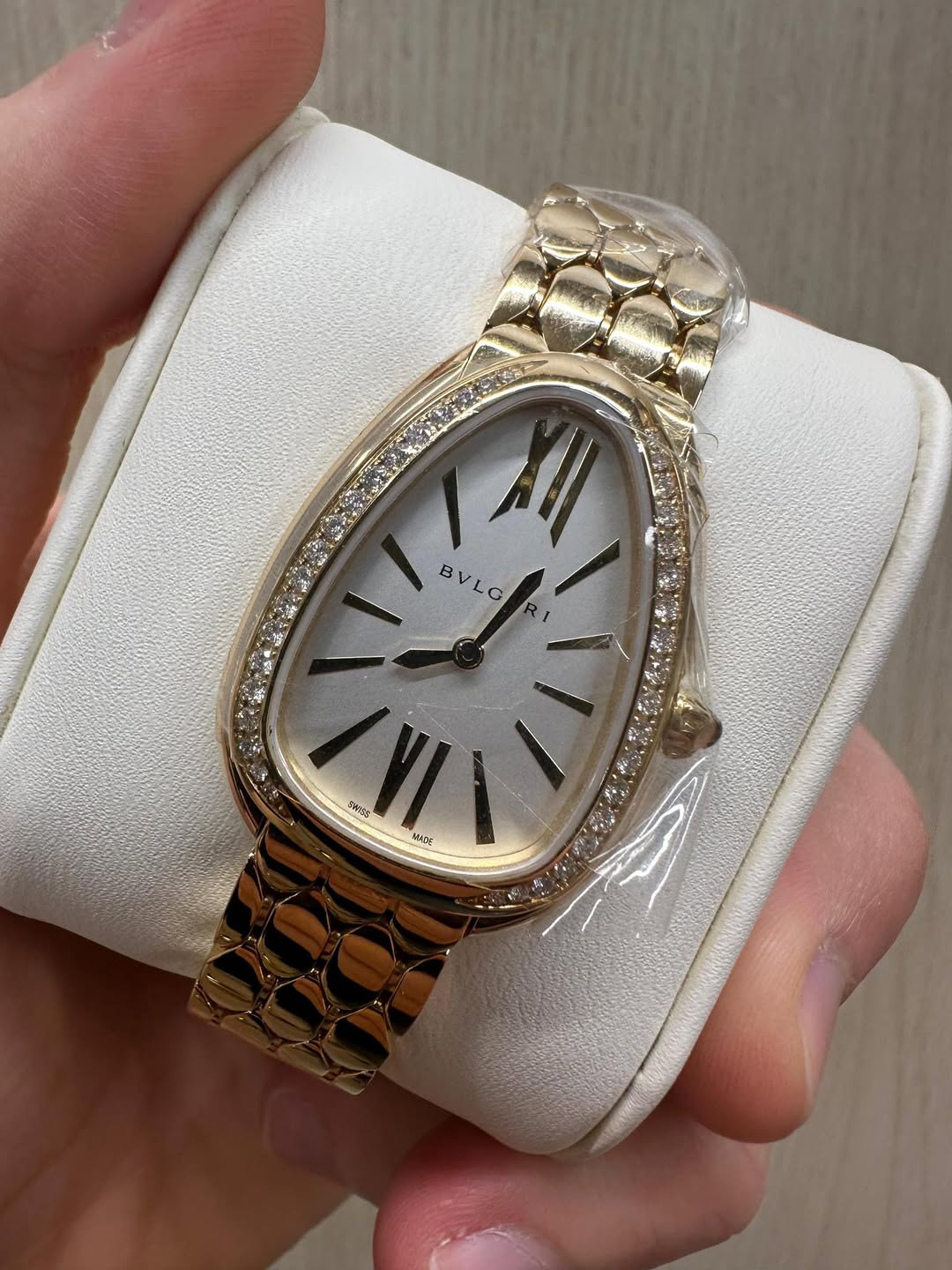 May be an image of wrist watch and text