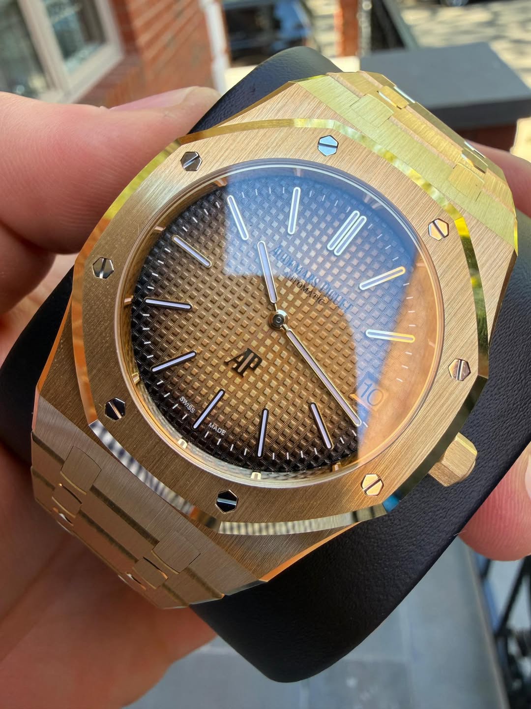 May be an image of wrist watch and text