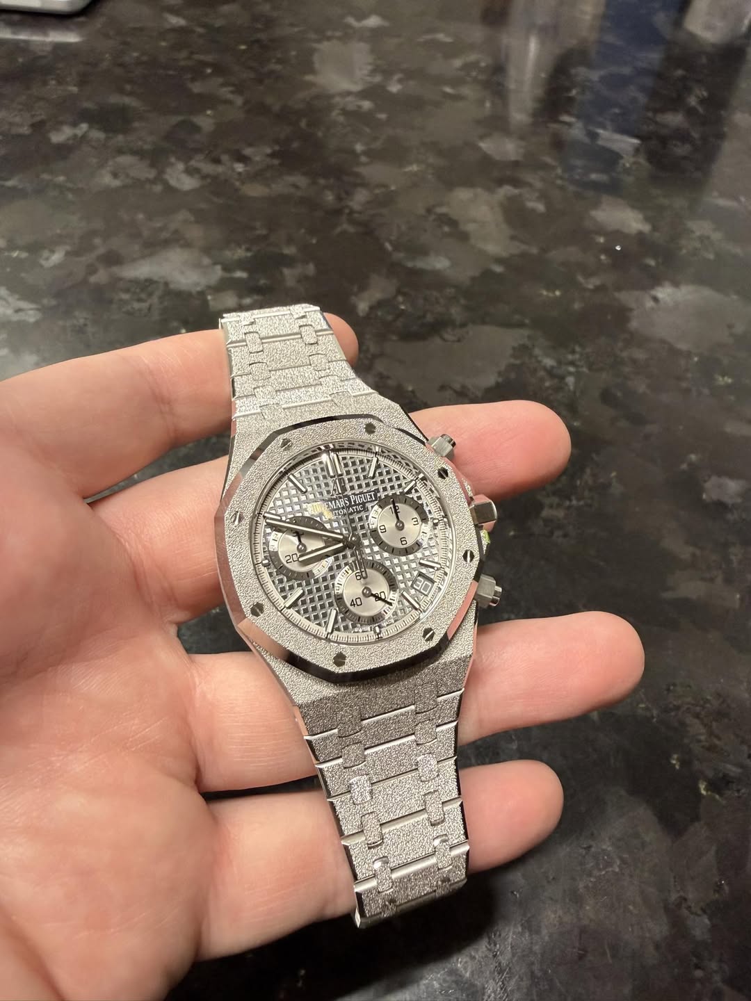 May be an image of wrist watch and text